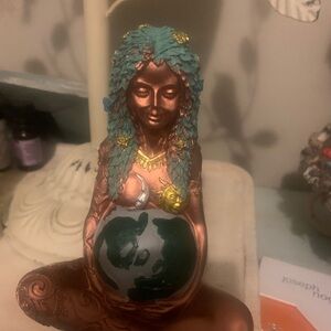 Copper-Toned Goddess Figurine with Teal Hair and Earth Motif